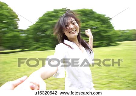 Stock Image - Smiling Japanese woman. Fotosearch