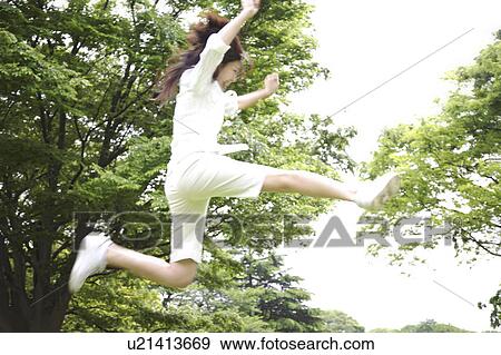 Stock Photo - Woman jumping. Fotosearch