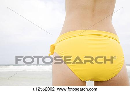 Stock Image - Back figure of Japanese woman in swimsuit. Fotosearch