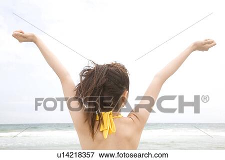 Stock Photo - Back figure of Japanese woman in swimsuit. Fotosearch