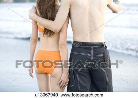Stock Image - Couple on beach. Fotosearch