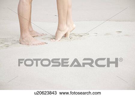 Feet of couple on a beach View Large Photo Image Stock Image - Feet of couple on a beach. Fotosearch
