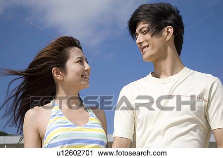 Stock Image - Japanese couple gazing each other. Fotosearch