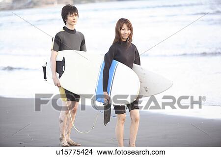 Picture - Japanese surfer in Enoshima beach. Fotosearch