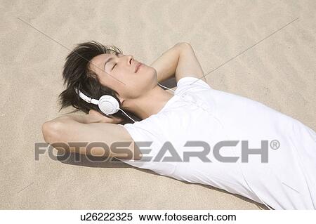 Stock Photography - Man listening to music. Fotosearch