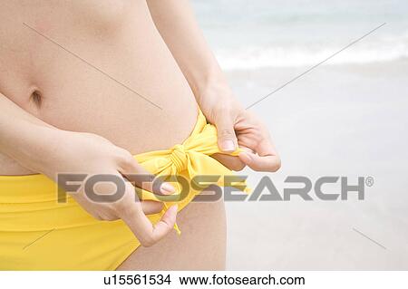 Picture - Waist of Japanese woman in swimsuit. Fotosearch