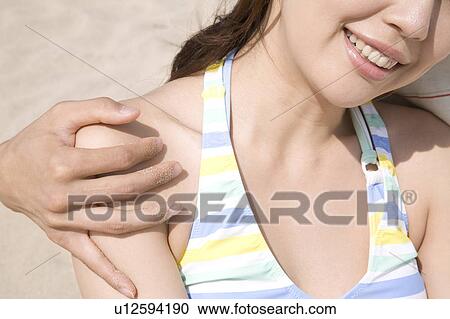 Woman embraced lover's arm View Large Photo Image Stock Image - Woman embraced lover's arm. Fotosearch
