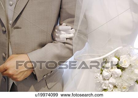 Arm of bridal couple View Large Photo Image Stock Photo - Arm of bridal couple. Fotosearch
