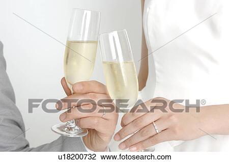Hands holding wine glass View Large Photo Image Stock Image - Hands holding wine glass. Fotosearch