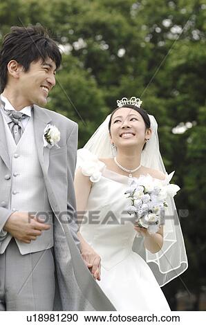 Stock Image - Smiling bridal couple. Fotosearch