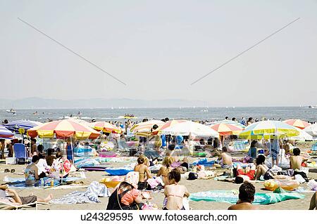 Stock Photography - Crowd of Japanese people in the beach. Fotosearch