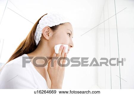 Stock Photo - Japanese woman doing skin care. Fotosearch