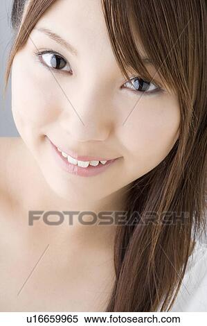 Stock Photography - Portrait of young woman. Fotosearch