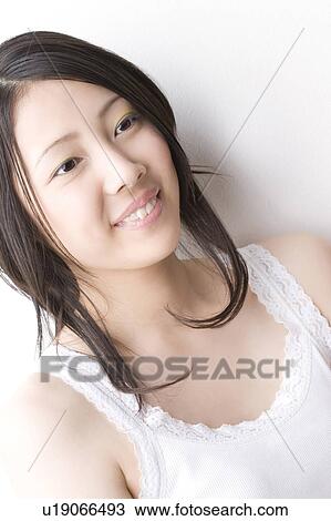 Stock Image - Smiling Japanese woman. Fotosearch
