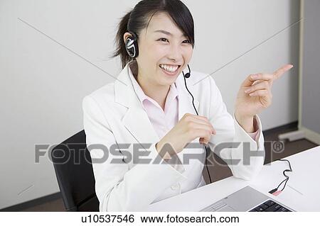 Business woman wearing headset View Large Photo Image Stock Photograph - Business woman wearing headset. Fotosearch