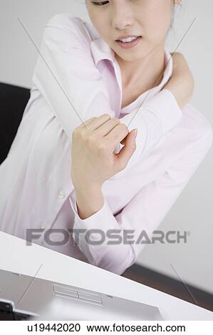 Stock Image - Office lady stretching. Fotosearch
