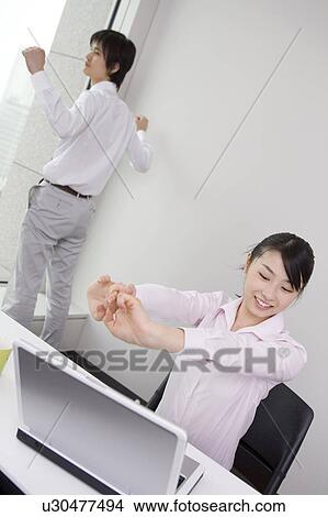 Picture - Office workers stretching. Fotosearch