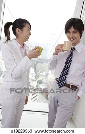 Stock Image - Office workers taking a coffee break . Fotosearch
