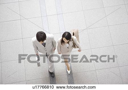 Office workers walking along together View Large Photo Image Stock Image - Office workers walking along together. Fotosearch