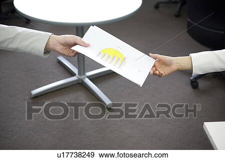 Stock Photo - Passing documents . Fotosearch