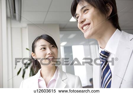 Stock Photography - Smiling office workers. Fotosearch
