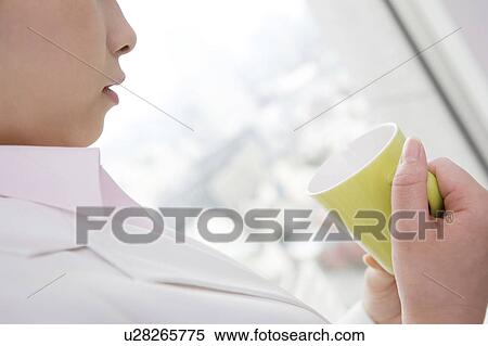 Woman holding a coffee cup View Large Photo Image Stock Photography - Woman holding a coffee cup. Fotosearch