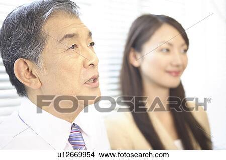 Picture - Businessman and woman. Fotosearch