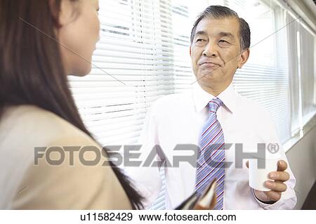 Stock Photo - Chief executive officer and secretary. Fotosearch