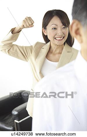 Stock Photo - Secretary pretending to strike CEO. Fotosearch