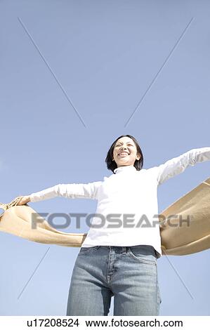 Woman below the blue sky View Large Photo Image Picture - Woman below the blue sky. Fotosearch