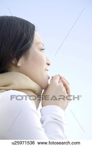 Woman below the blue sky View Large Photo Image Stock Photograph - Woman below the blue sky. Fotosearch