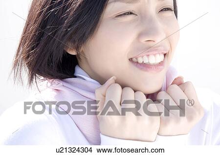 Woman wearing a muffler View Large Photo Image Picture - Woman wearing a muffler. Fotosearch