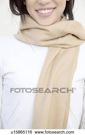Woman wearing a muffler View Large Photo Image Stock Photograph - Woman wearing a muffler. Fotosearch