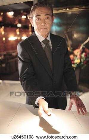 Executive holding credit card View Large Photo Image Stock Photo - Executive holding credit card. Fotosearch