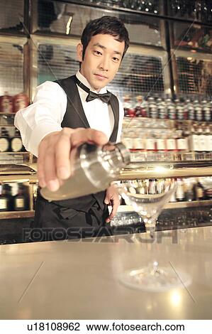 Stock Image - Japanese bartender. Fotosearch