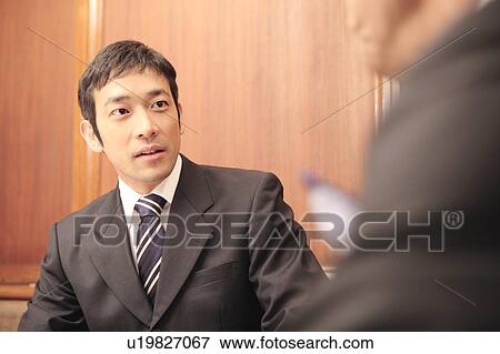 Stock Photo - Portrait of Japanese office worker. Fotosearch