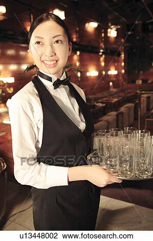 Stock Image - Portrait of Japanese waitress. Fotosearch