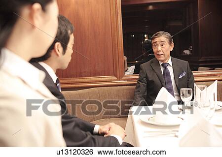 Scene of dinner meeting View Large Photo Image Stock Photograph - Scene of dinner meeting. Fotosearch