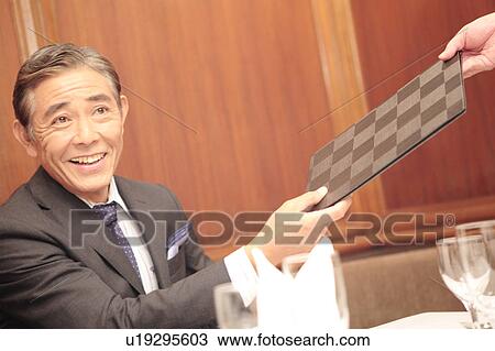 Stock Image - Smiling executive. Fotosearch