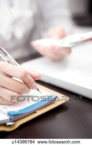 Japanese office lady taking a memo View Large Photo Image Picture - Japanese office lady taking a memo. Fotosearch