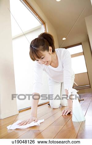 Stock Photograph - Japanese woman cleaning up the floor. Fotosearch