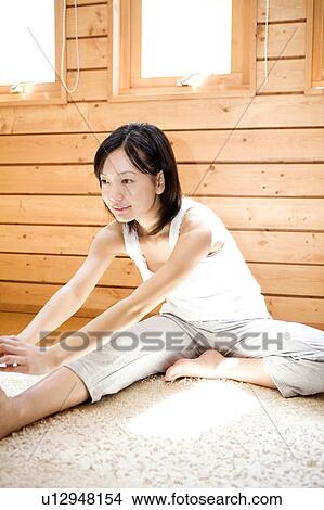 Picture - Japanese woman doing exercise. Fotosearch