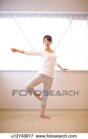 Stock Photo - Japanese woman doing exercise. Fotosearch