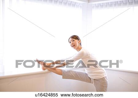 Stock Photography - Japanese woman doing exercise. Fotosearch