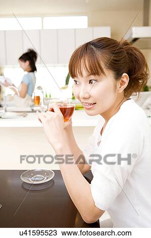 Stock Image - Japanese woman drinking a tea. Fotosearch