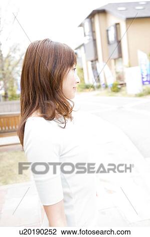 Stock Image - Japanese woman taking a walk. Fotosearch