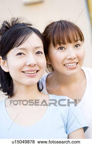 Two women outdoors View Large Photo Image Stock Photo - Two women outdoors. Fotosearch