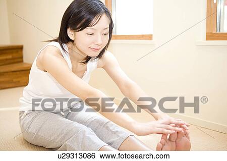 Woman stretching View Large Photo Image Stock Photograph - Woman stretching. Fotosearch