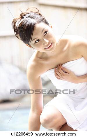 Stock Photo - Japanese woman at the open-air bath. Fotosearch