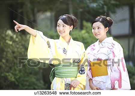 Japanese woman putting on a yukata View Large Photo Image Stock Photo - Japanese woman putting on a yukata. Fotosearch